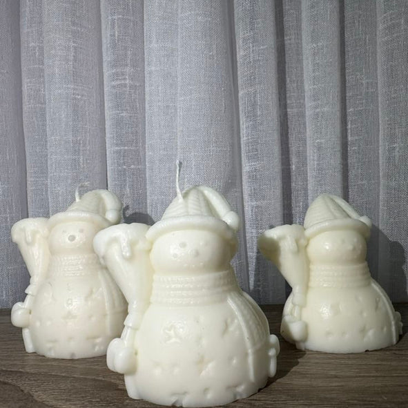 Snowman with stick candle