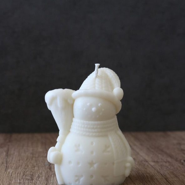 Snowman with stick candle
