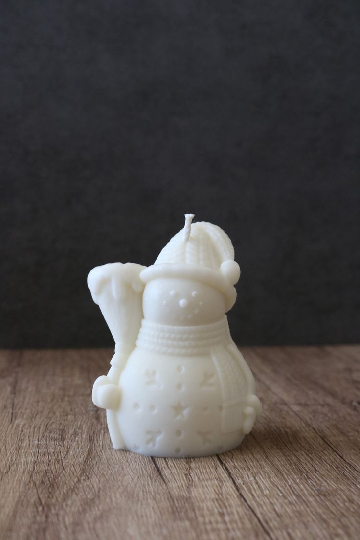 Snowman with stick candle